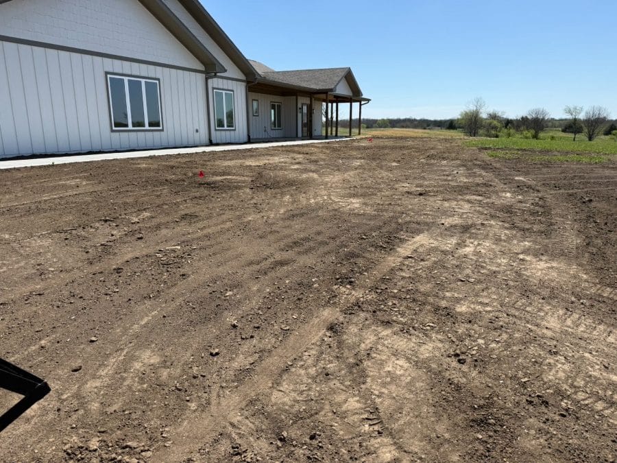 Graded dirt yard around a new build ready for seed